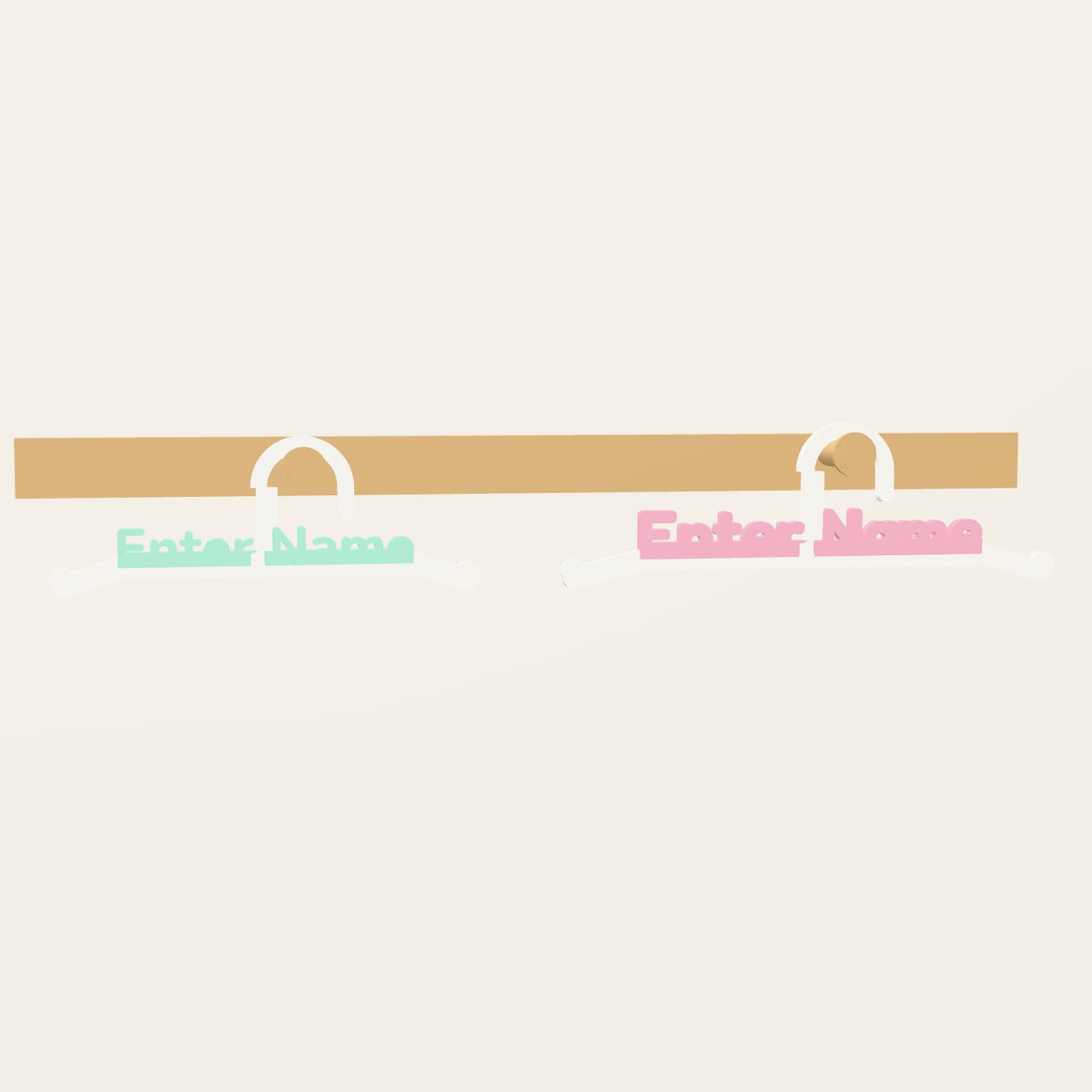 Two name hangers on wall pegs - the name in mint and in pink, the rails white