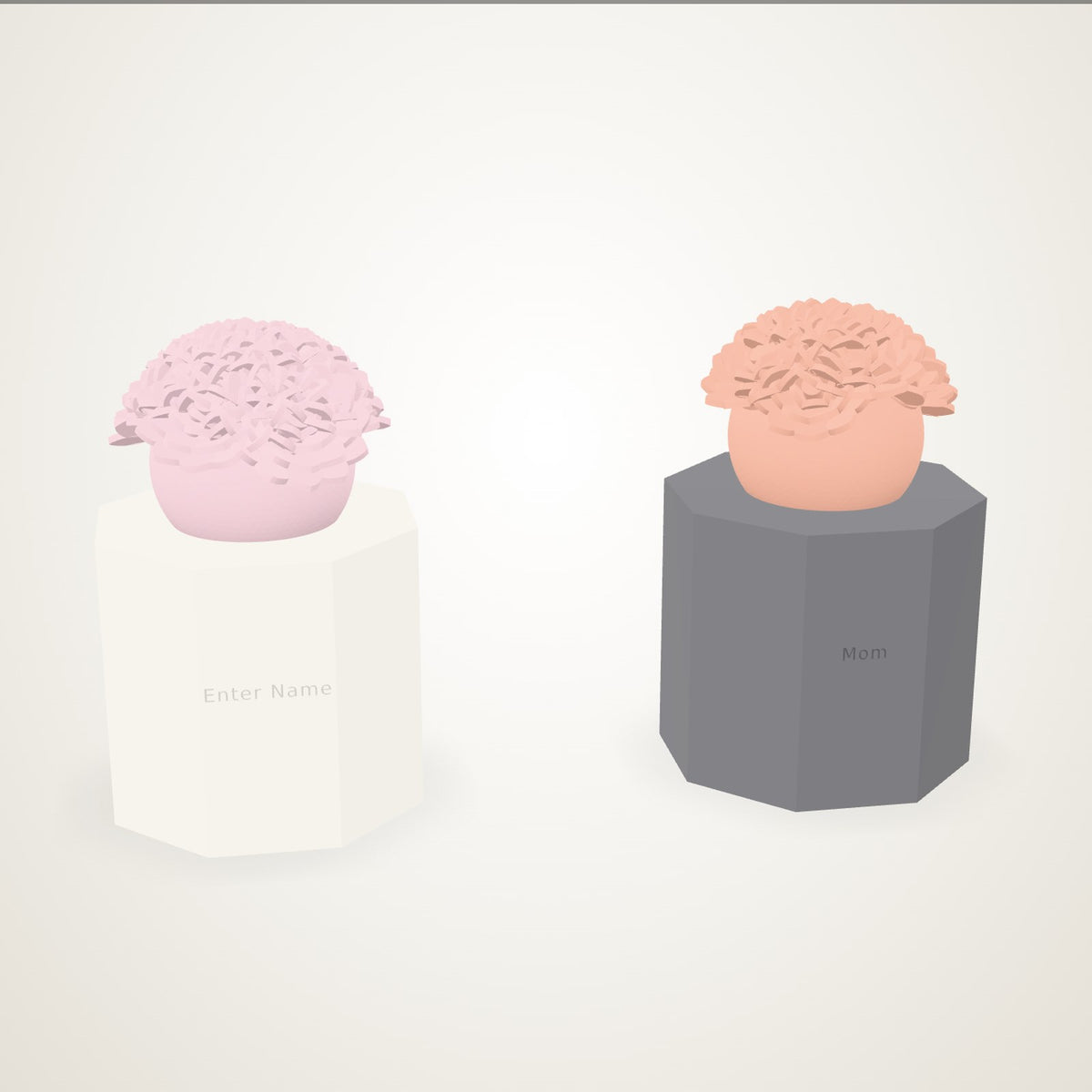 Two posies in their vases - blush peonies in an ivory vase engraved Enter Name, coral peonies and roses in a charcoal vase engraved Mom