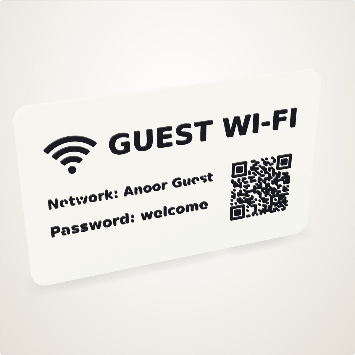 A 3D printed guest Wi-Fi sign designed on the canvas: black lettering, the Wi-Fi mark and a QR code raised on a white plate
